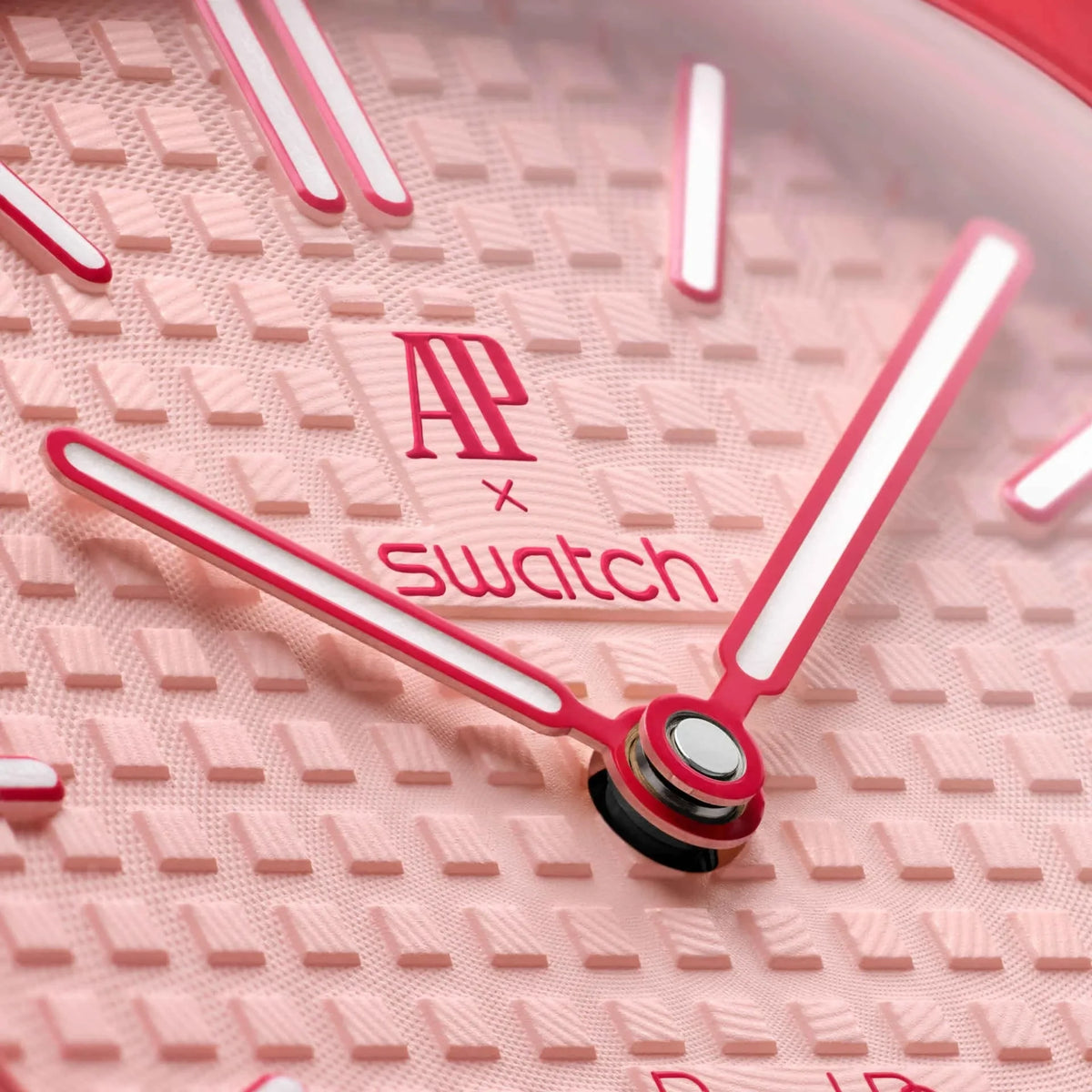 Close-up of inkspireluxury Audemars Piguet x swatch pocket watch featuring a textured pink dial and bold hands